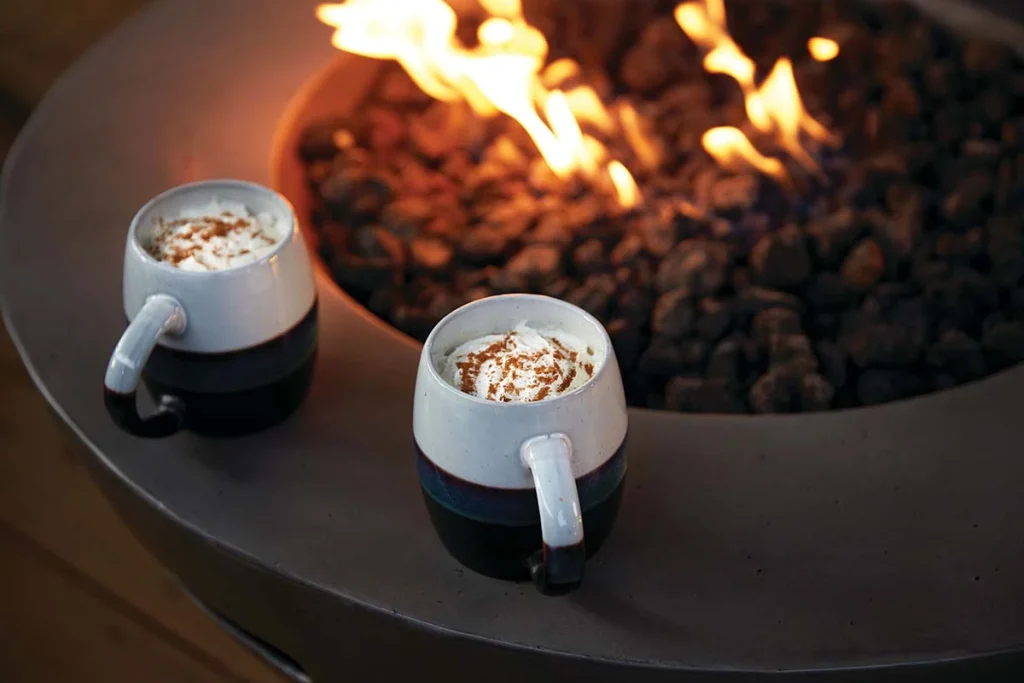 Napoleon Nexus Firetable Round in Winter with Hot Chocolates.